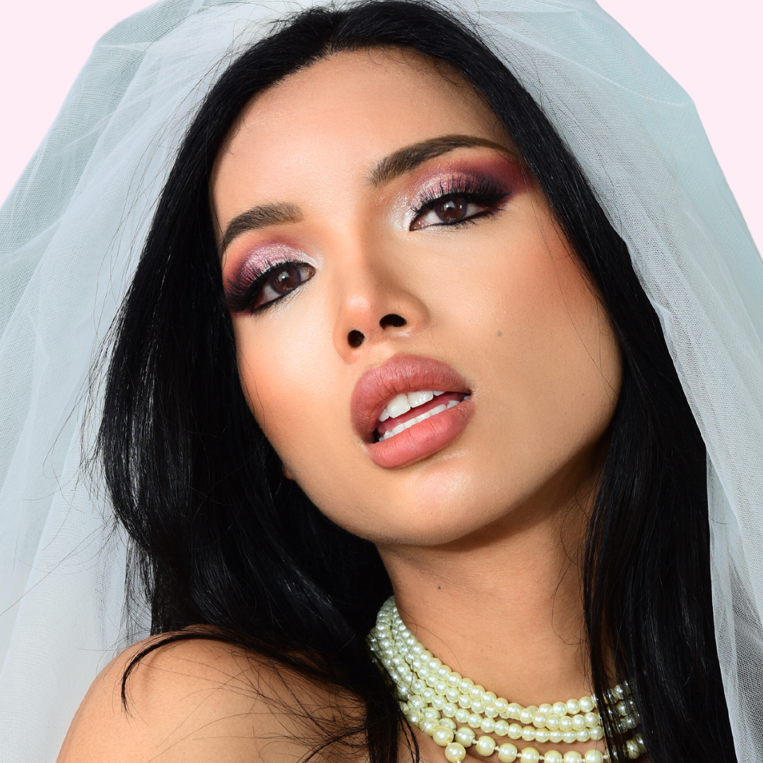 Black hair woman wearing wedding false lashes